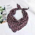 Detail of pink floral silk scarf with scalloped navy edges on a white backdrop - Small Floral Pink
