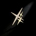 Detail shot of a modern triple star brooch with zircon inlay and polished gold finish - Micro-inset Large Star Brooch (D)