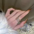 Elegant gold double C ring with sparkling pave crystals worn on finger for a stylish look - Gold Plated Cross Style (1-1-22)