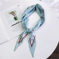 Light blue diamond silk scarf with red polka dots and striped border on white table - Blue Two-tone Polka Dot
