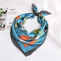 Close-up of blue satin square scarf with vintage belt and chain prints on white fabric - 70x70cm / Blue Duke Pattern