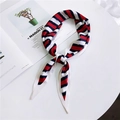 Red, white, and navy blue striped silk scarf styled with a fashion magazine - Three Red Stripes