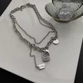 Collana a doppio strato in acciaio al titanio argento con ciondoli tigre e scritte lucky - Argento