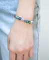 Rainbow Millefiori glass bead bracelet featuring colorful floral patterns worn on wrist - Single Layer Glass Bracelet (01-G16)