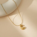 Golden balloon initial C pendant necklace with refined snake chain on beige surface - C With Snake Chain
