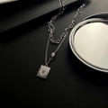 Double-layered silver titanium necklace with rectangle coin pendant and pearl accent - Silver