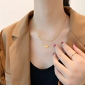 Double-layered gold anklet with heart and Love pendant shown on model in a blazer - Double Layer LOVE Heart Necklace (02-B1#) / Gold