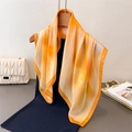 Detail of orange gradient silk scarf with satin luster on a wooden hanger - 66-70cm / Orange Yellow Print