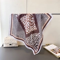 Detail of elegant leopard print satin square scarf with chic monochrome stripes on display - 66-70CM / White Border (FG112-4)