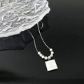 Korean style silver necklace with white beads and Love Me engraved square pendant - Silver