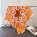 Detail of vintage geometric star print silk scarf draped on a metal display stand - 66-70CM / Orange Yellow (FG108-4)