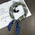 Silk satin square scarf with green stripes and chain pattern on a wooden table - Blue Belt Chain