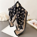 Elegant black cotton-linen scarf with vintage floral prints on a white hanger - Black
