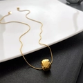 Golden titanium steel necklace with a geometric honeycomb cylinder pendant on snake chain - Gold