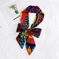 Slim silk scarf with colorful geometric prints tied in a bow on textured white background - 31 Sun Oil Painting