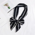 Elegant black silk ribbon scarf with white stripes tied in a bow on a white surface - 25 Black Vertical Stripe