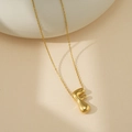 Collier avec pendentif lettre F potelée en or poli et chaîne fine minimaliste élégante - Lettre Bulle F (Avec Chaîne Cruciforme)