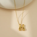 Collier doré avec pendentif lettre H arrondi et poli au fini brillant de style moderne - Lettre Bulle H (Avec Chaîne Cruciforme)