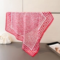 Leopard print silk scarf in red and white with geometric borders hung on a stand - Red (FG150-1) / 66-70cm