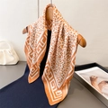 Elegant leopard print silk scarf with Greek key border displayed on a wooden hanger - Orange (FG150-2) / 66-70cm