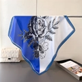 Detail of elegant floral silk scarf with blue border and monochrome rose prints - Blue