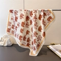 Detailed close-up of exotic elephant pattern silk scarf draped on a metal stand - Beige Coffee (FG177-3)