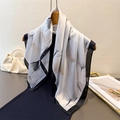Elegant floral silk scarf with black borders hung on a hanger over a black dress - Black (FG174-4) / One Size