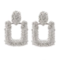 Boucles d'oreilles géométriques en argent avec texture métal lourd et pendentif rectangle - Argenté