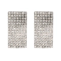 Close-up of geometric pavé-set rectangle stud earrings with sparkling crystals - White