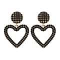 Elegantes pendientes colgantes dorados con grandes corazones huecos y cristales negros - Negro