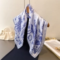 Elegant white silk scarf with blue bird and floral print draped on a hanger - Blue (FG178-4)