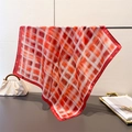 Vintage red plaid silk scarf for women styled on a hanger with a stylish handbag - 66-70cm / Red
