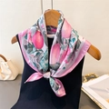 Detailed view of floral silk scarf tied as a bow on wooden hanger with knitwear - 66-70cm / Pink (FG212-2)