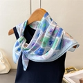 Detail of printed silk scarf with stamp patterns of lobster and lemon on black vest - 70cm x 70cm / Blue (FG228-1)