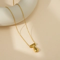 Collier doré poli avec un gros pendentif en forme de lettre T et chaîne fine - Lettre Bulle T (Avec Chaîne Cruciforme)