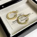 Macro view of gold hoop earrings with frosted texture in a jewelry box - Matte Hoop Style (C208) / Gold