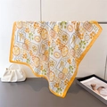 Detailed shot of yellow and white tropical print silk scarf with palm tree and sardine motif - One Size / Orange