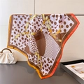 Satin square scarf with polka dots and gold chain print draped on a metal rack - 66-70cm / Brown (FG217-1)