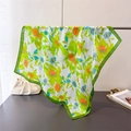 Detail of a tropical floral silk scarf hanging with vivid green borders and glossy finish - 70cmx70cm / Green (FG231-2)