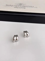 Detailed close-up of glossy silver double-ribbed wave earrings on minimalist background - Silver (c116)