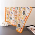 Detail of printed silk scarf with tropical palm trees and toucans in vibrant orange tones - 66-70cm / Orange