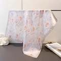 Elegant white tulip floral silk scarf with satin edges hanging on a metal bar display - Light Beige