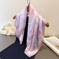 Elegant tulip floral print silk square scarf with pink borders on a wooden hanger - Pink