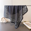 Detail of navy blue silk scarf featuring white polka dots and geometric diamond patterns - 66-70cm / Black