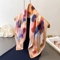 Elegant summer silk scarf with abstract colorful prints displayed on a wooden hanger - 66-70cm / Tan