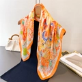 Close-up of floral butterfly print silk scarf on hanger with elegant drape and vibrant colors - 70cm*70cm / Warm Orange (FG238-4)