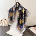 French silk scarf with butterfly print in navy blue on a mannequin with a handbag - Navy Blue / 70cm