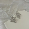 Close-up of matte silver irregular wrinkled earrings with a minimalist abstract design - Silver Style (D203)