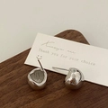 Detail shot of irregular lava silver earrings on dark wood with S925 engraved silver posts - Silver Moon Earrings