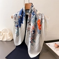 Silk-like square scarf with leopard floral print displayed on a wooden hanger - Off White